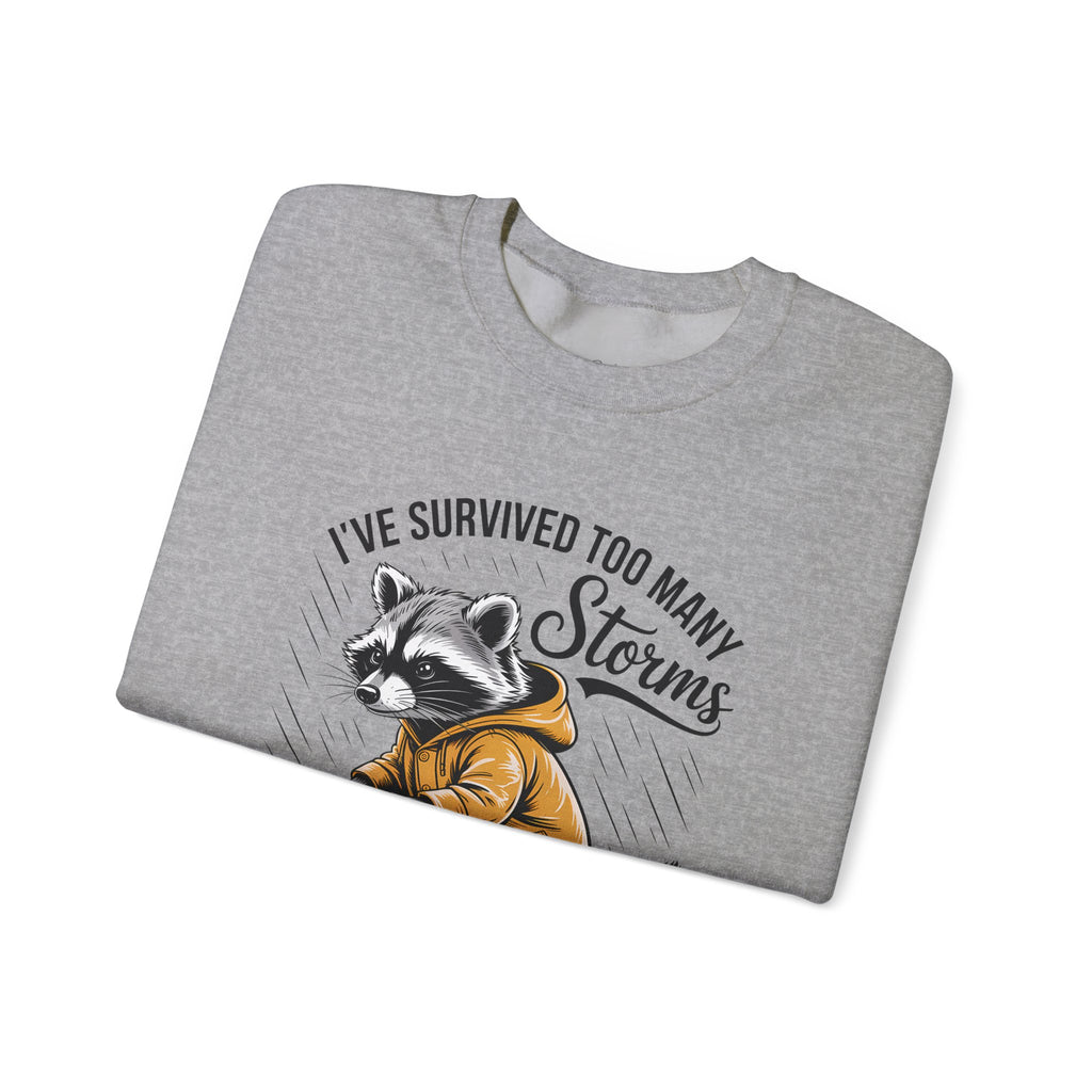 Crewneck Sweatshirt — "I've Survived Too Many Storms" Raccoon Graphic Unisex